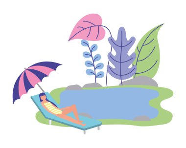 Gölde şemsiyeyle güneşlenen kadın dinleniyor.