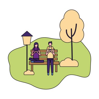 parkta cep telefonlarını kullanarak çift