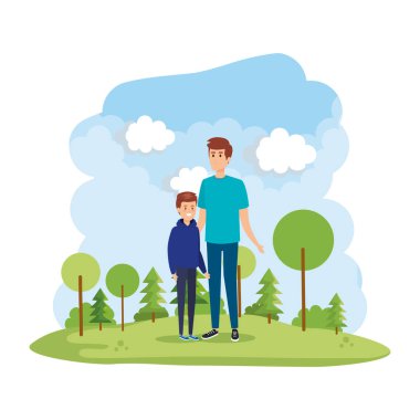 Park sahnesinde oğlu olan genç bir baba.