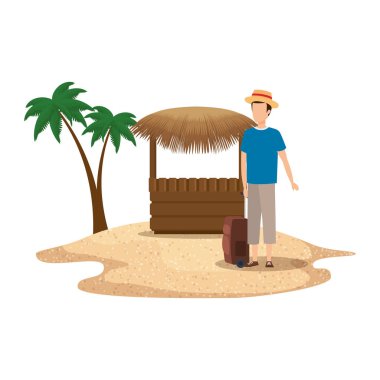 Bavullu genç adam sahilde seyahat ediyor.