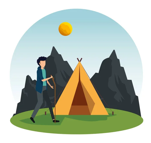 Man walking with stick and camp with mountains and sun — Stock Vector