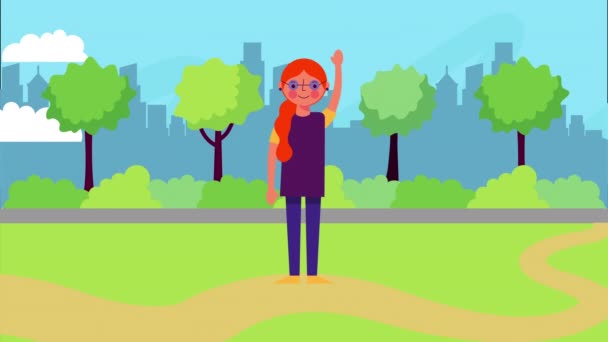 Young woman waving in park landscape — Stock Video