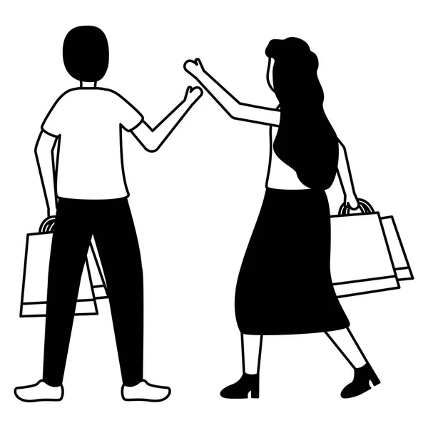 Homem e mulher com sacos de compras —  Vetores de Stock