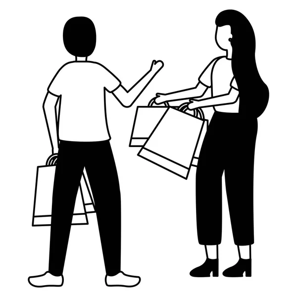Hombre y mujer con bolsas de compras — Vector de stock