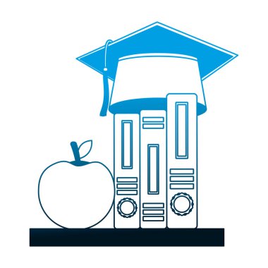 eğitim kitapları ve elma üzerinde mezuniyet şapka