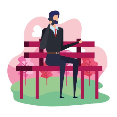 park koltuğunda oturan akıllı telefon ile arayan zarif işadamı