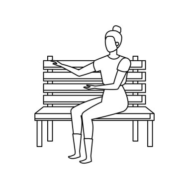 park sandalyesinde oturan güzel ve genç kadın