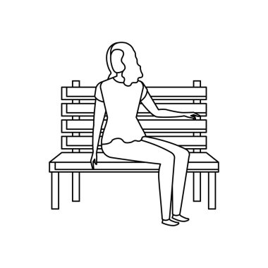 park sandalyesinde oturan güzel ve genç kadın