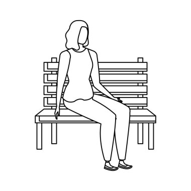 park sandalyesinde oturan güzel ve genç kadın