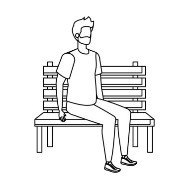 park sandalyesinde oturan sakallı genç ve rahat adam