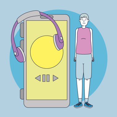 Kulaklığı ve akıllı telefonu olan genç bir adam.