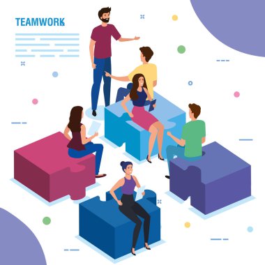 Ekip çalışanları bulmaca parçalarında oturuyor