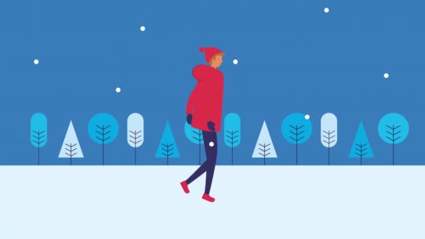 Jeune homme marchant dans le paysage de neige — Video