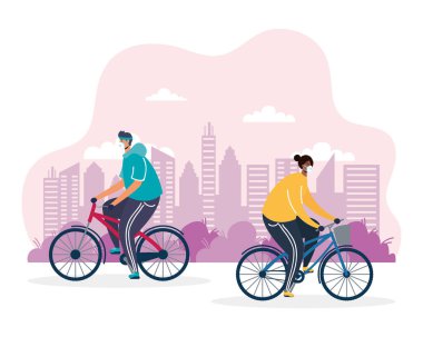 Bisiklet süren genç adamlar tıbbi maske takıyor