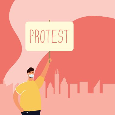 Tıbbi maskeli bir adam pankartla protesto ediyor.