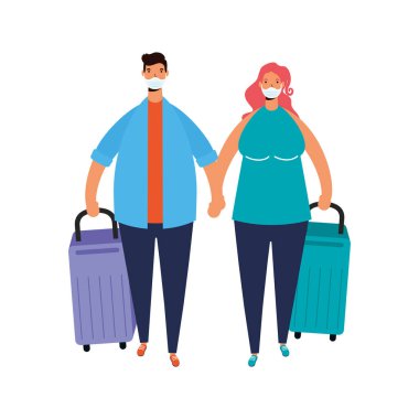 Genç çift bavullu tıbbi maske takıyor.