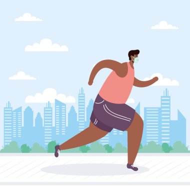 Tıbbi maske takan genç afro adam Avatar karakterini çalıştırıyor.