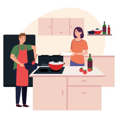 Mutfakta yemek pişiren çift.