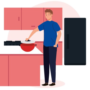 Adam mutfakta çekmeceler, buzdolabı ve malzemelerle yemek pişiriyor.