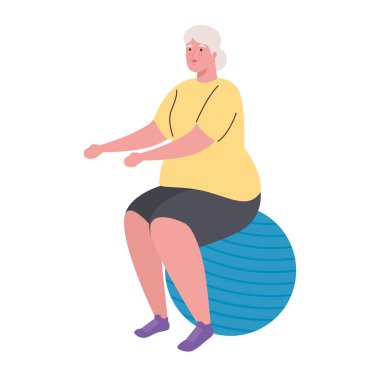 Yaşlı kadın top plastiği ve spor egzersiz konseptiyle egzersiz yapıyor.