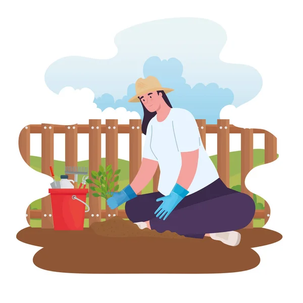 Femme de jardinage avec seau à outils et conception vectorielle végétale — Image vectorielle