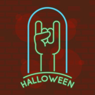 İçinde rock 'n roll sembolü olan neon ışıklı cadılar bayramı harfleri.