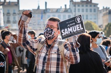 LYON, FRANCE - OCTOBER 18, 2020 : Anti terrorism protest after 3 days islamic terrorist attacks : Professor Samuel Paty was beheaded in front of his college after being accused of showing cartoons of Mohammed during a course on freedom of thought. clipart