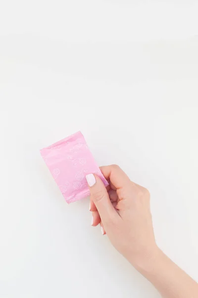 Mano Mujer Con Pulido Manicura Pastel Sosteniendo Una Servilleta Sanitaria —  Fotos de Stock