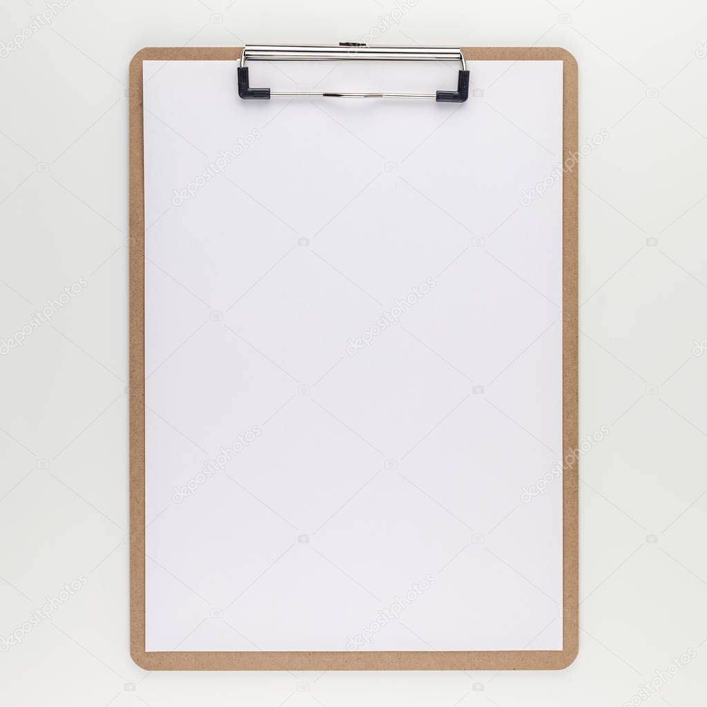 Square top view mock up of workspace desk styled recycled empty clip board with copy space white table background minimal eco style. Concept start up or new day. Presentation, design, text template