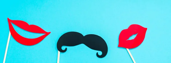 Creative long wide banner top view retro stylish black paper photo booth props moustaches turquoise background copy space. Men health awareness month fathers day masculinity concept blog social media