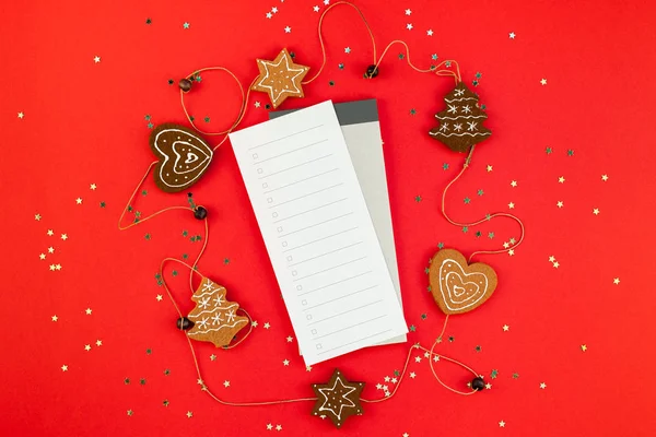 Creative New Year or Christmas checklist event planner mockup flat lay top view Xmas holiday celebration to do list on red paper background golden glitter. Template mock up text design 2019 2020