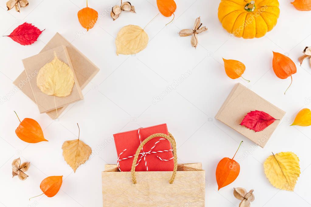 Creative Top view flat lay autumn composition Shopping bag dried orange flowers leaves pumpkins background copy space Template sale mockup fall harvest thanksgiving halloween promotion flyers text