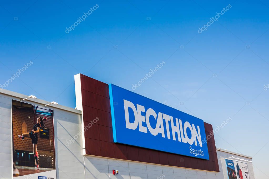 SAGUNTO, SPAIN - FEBRUARY 08, 2019: Decathlon store is a French company of sporting goods distribution retail chain brand logo at building located in Sagunto shopping area Spain. Blue sky background