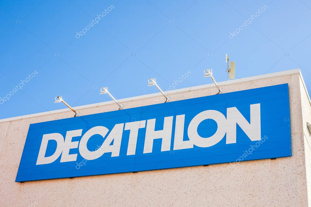 ORIHUELA, SPAIN - FEBRUARY 13, 2019: Decathlon store is a French company of sporting goods distribution retail chain brand logo at building located in Orihuela shopping area Spain. Blue sky background