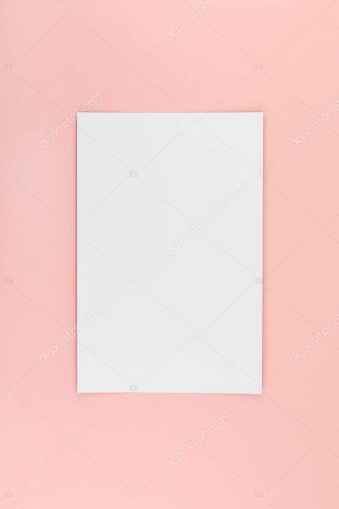 Blank A4 paper sheet mockup on pink background