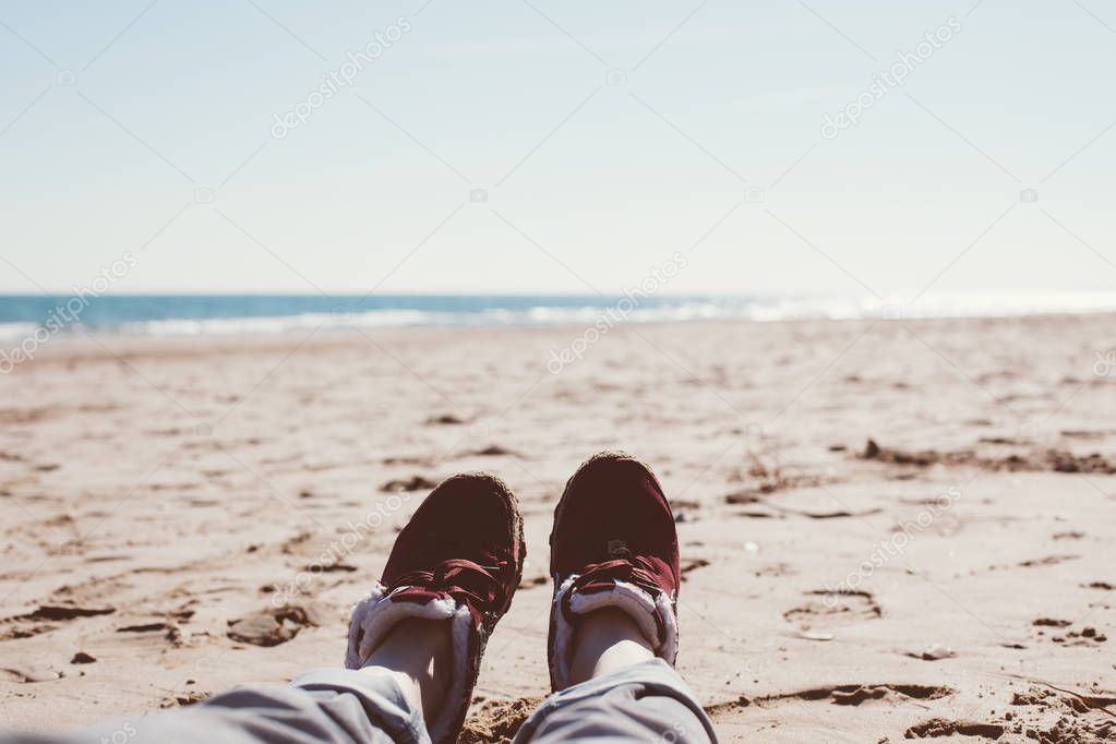 Girl relaxing on sand beach