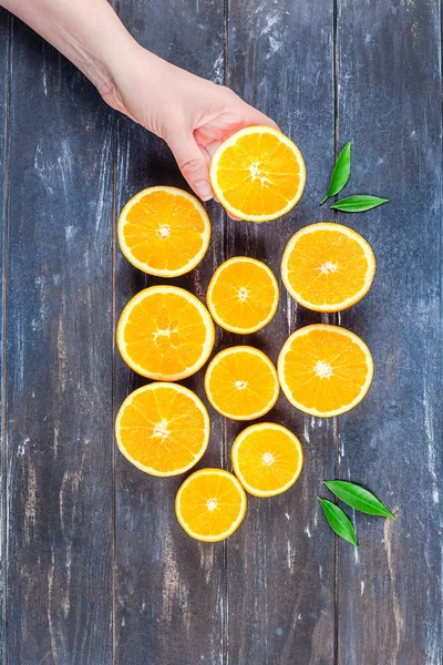 Fresh oranges on dark wooden background — Stock Photo, Image