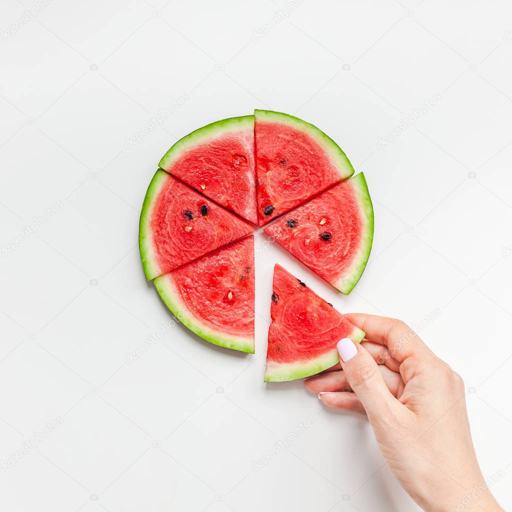 Fresh watermelon slices in woman hands