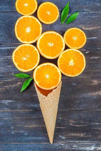 Fresh oranges on dark wooden background — Stock Photo, Image
