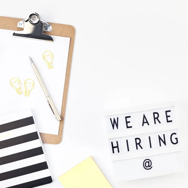 We are hiring flat lay on white background
