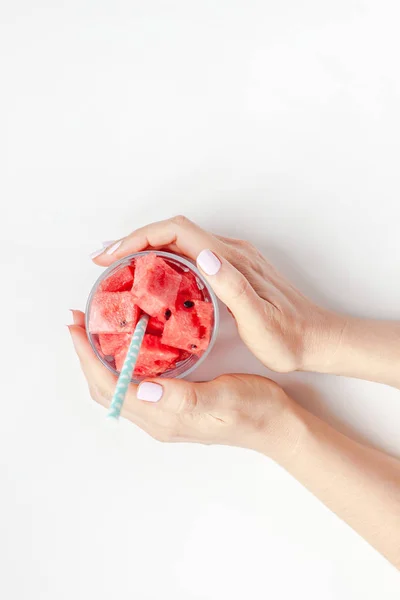 Woman hands with crushed watermelon in glass — Stock Photo, Image