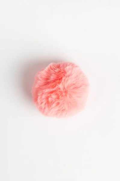 Coral fluffy fur ball on white background — Stock Photo, Image