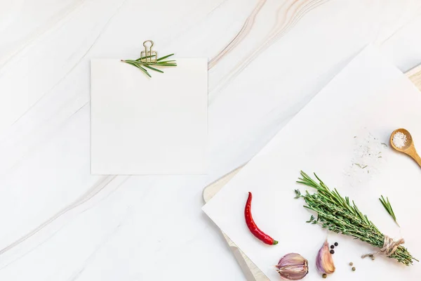 Blank notepad pages with greens herbs and spices — Stock Photo, Image