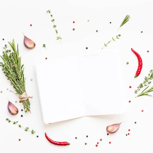 Blank notepad pages with greens herbs and spices — Stock Photo, Image