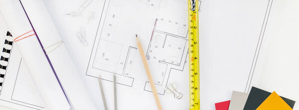 Interior designer table workplace with house plan