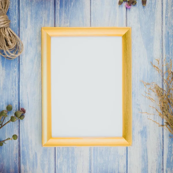 Golden frame mock up with autumn plants