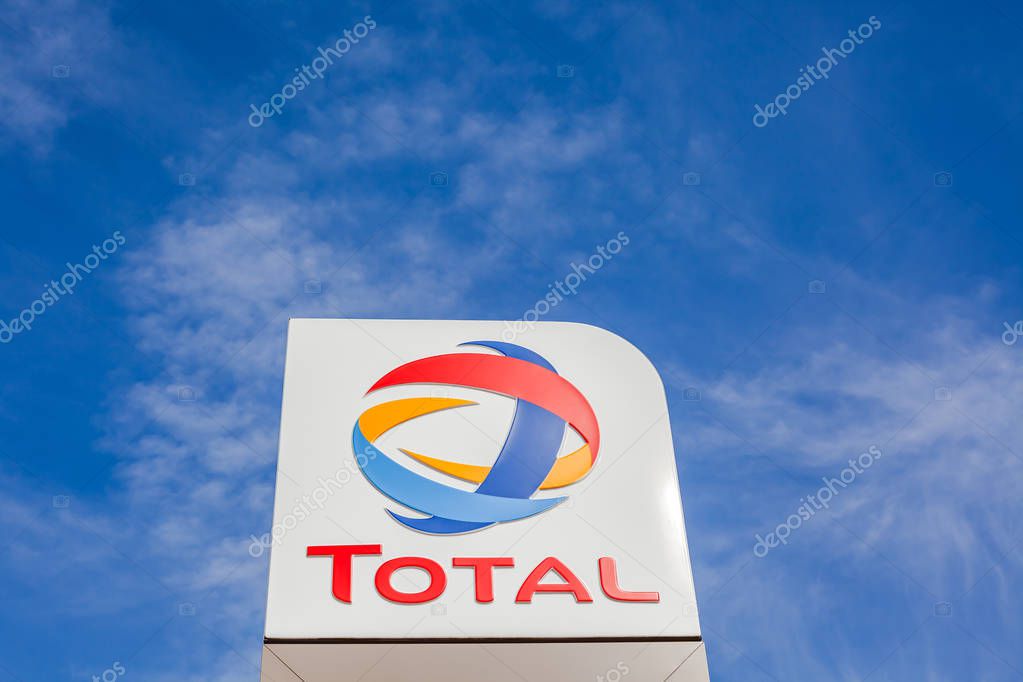 LYON, FRANCE - FEBRUARY 26, 2019: Total, French multinational oil and gas company logo on its gas service station in Lyon, France on blue sky background