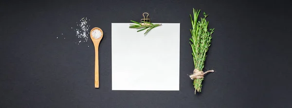 Blank notepad page with greens herbs and spices