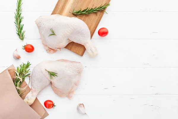 Fresh raw chicken legs with herbs. Cooking concept