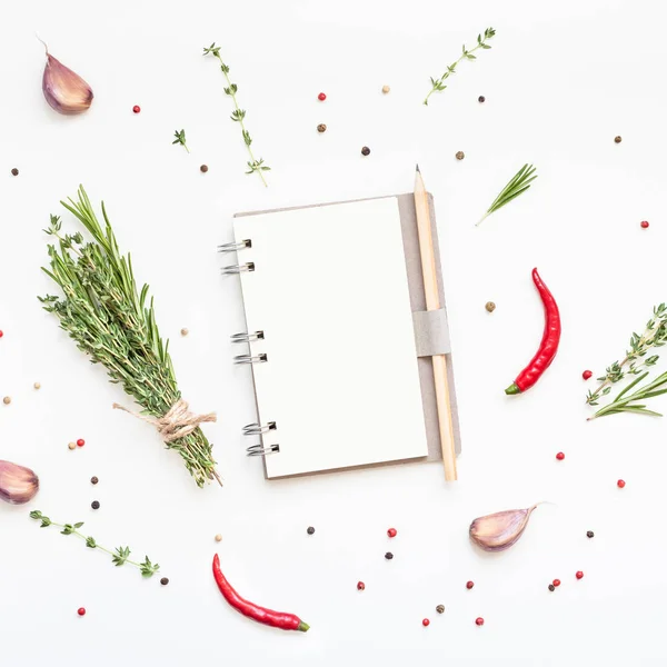 Blank notepad pages with greens herbs and spices — Stock Photo, Image